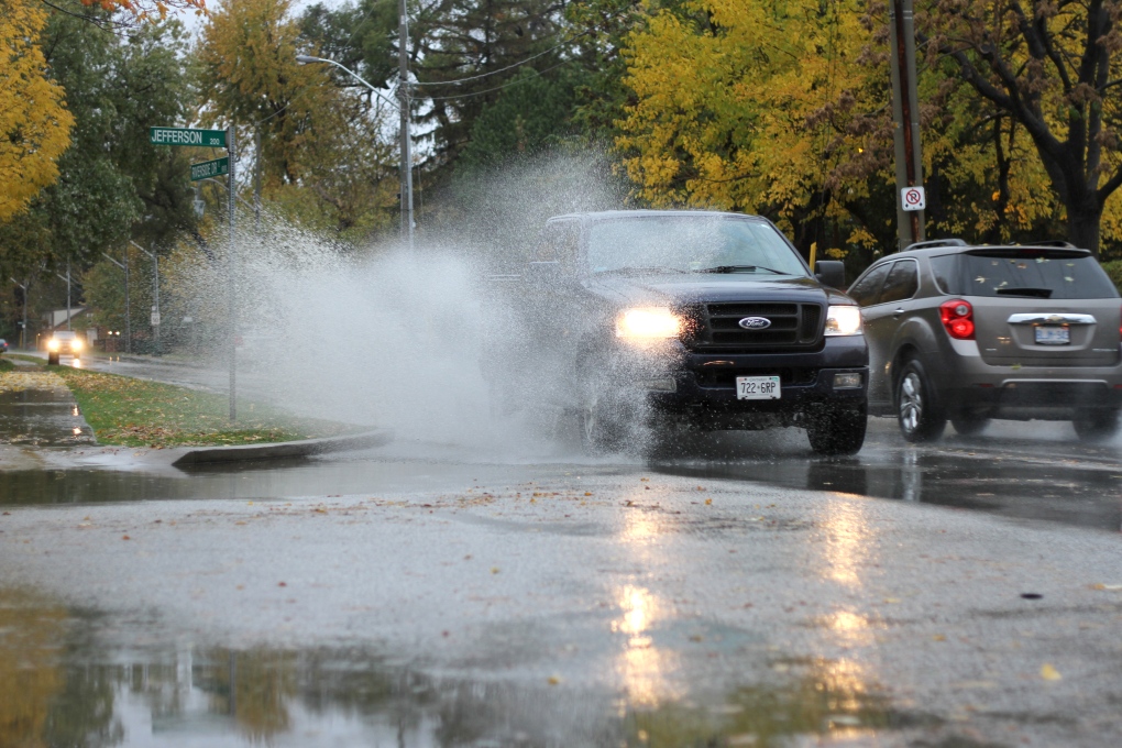A truck splashes through a puddle on Riverside Drive in Windsor, Ont., on Wednesday, Oct. 28, 2015. (Melanie Borrelli / CTV Windsor)