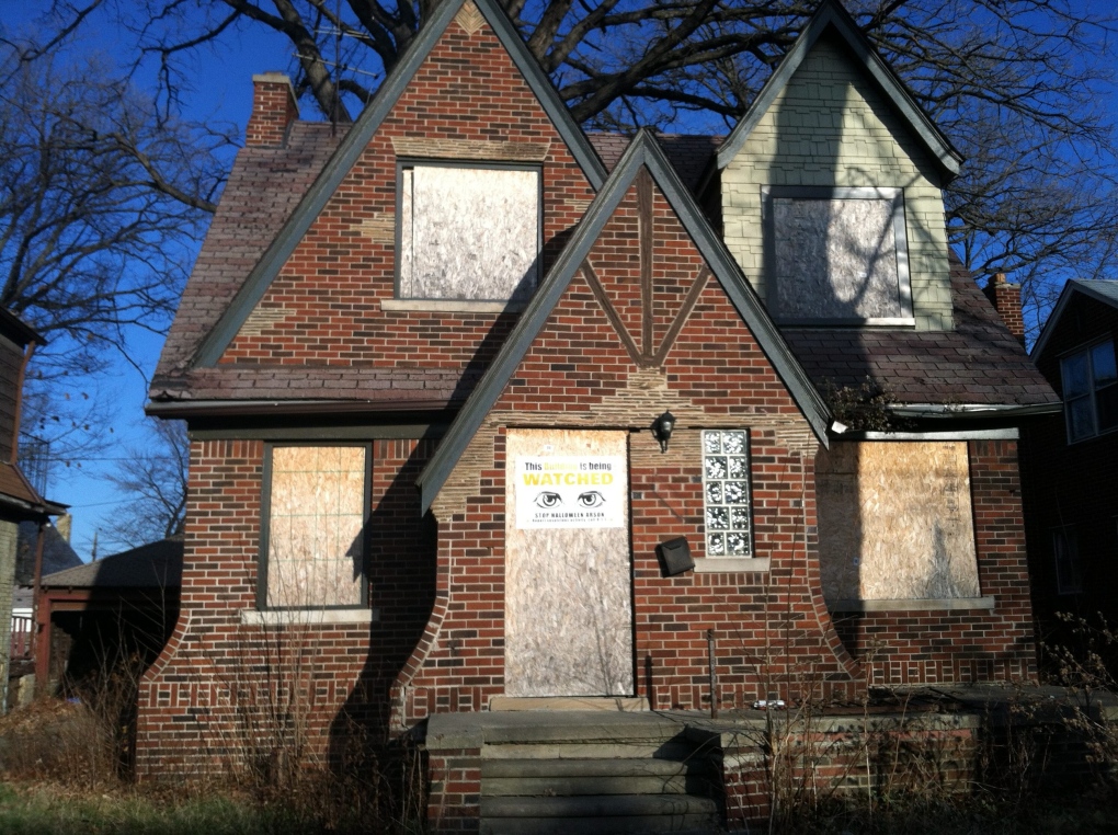 This Dec. 3, 2014 photo shows an abandoned house in Detroit, one of thousands of dilapidated buildings in Detroit. Many abandoned homes and vacant lots are being foreclosed upon this spring and thousands of them will eventually be auctioned for $500 apiece. (Beth J. Harpaz / AP Photo)