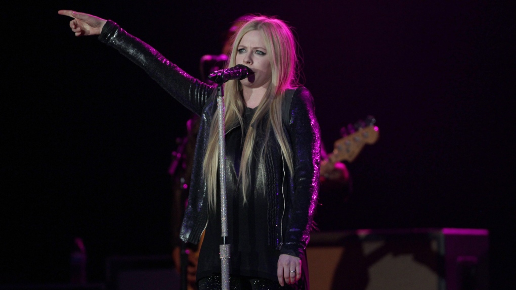 Avril Lavigne performs on stage during a concert at the Paramount, in Huntington, N.Y., Wednesday, Dec.11, 2013. (Donald Traill / Invision)