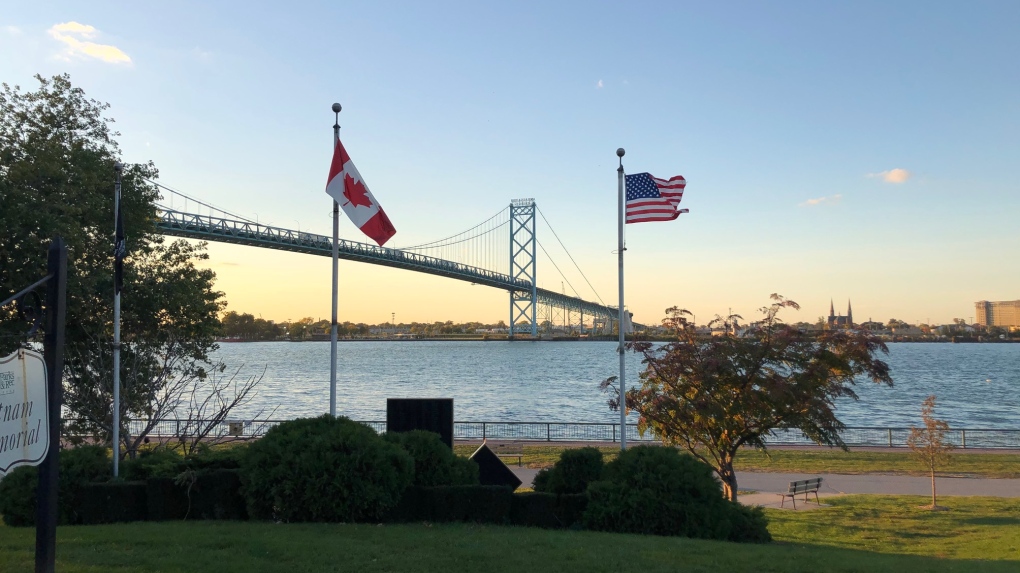 Canada and U.S. flags near the Ambassador Bridge border crossing in Windsor, Ont., on Thursday, Oct. 8, 2020. (Melanie Borrelli / CTV Windsor)