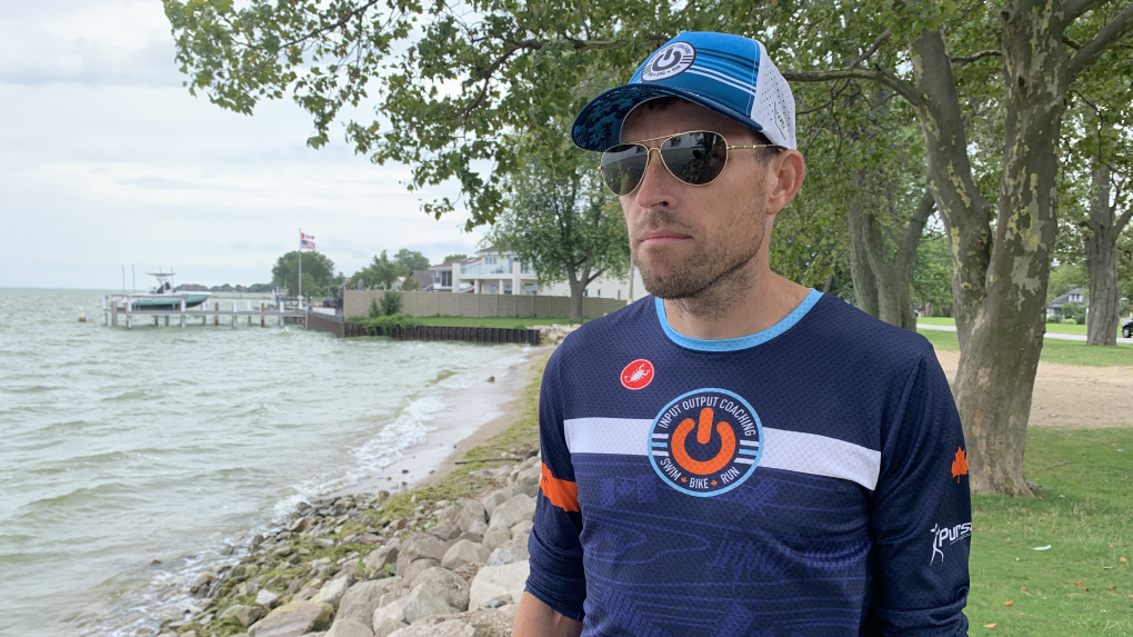 Matt Gervais, a Windsor Ironman triathlete, looks out at Lake St. Clair on Aug. 16, 2021. Just days earlier, his hand was bitten by a Muskie during an open water swim. (Rich Garton / CTV Windsor)