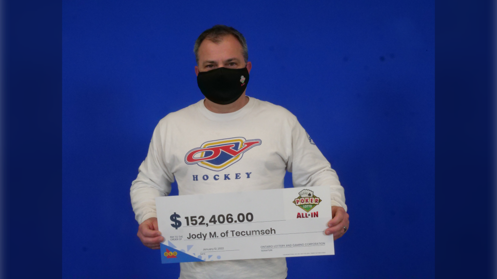 Jody Maurice of Tecumseh at the OLG Centre in Toronto, Ont. with his winnings. (Courtesy OLG)