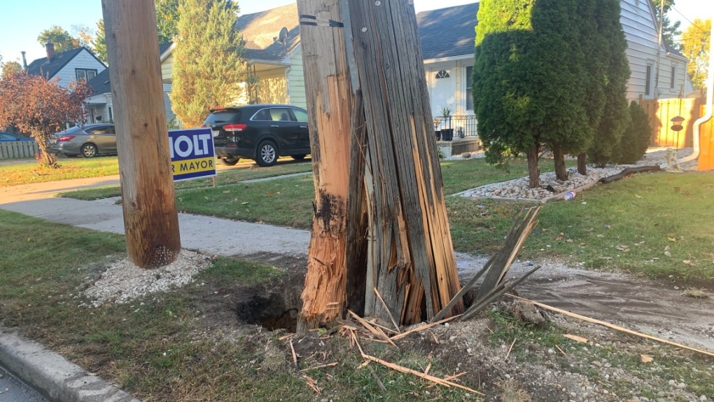 A brand new pole and the old one were cracked during a single-vehicle collision on Matchette Road in Windsor, Ont., on Tuesday, Oct. 4, 2022. (Bob Bellacicco/CTV News Windsor)