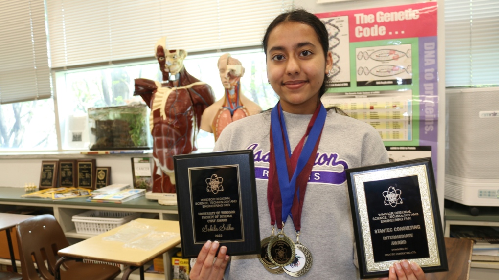Sohila Sidhu, a Grade 10 student at Assumption holds up her hardware from a recent science fair contest in Windsor, Ont. (SOURCE: Stephen Fields/Windsor-Essex Catholic District School Board)