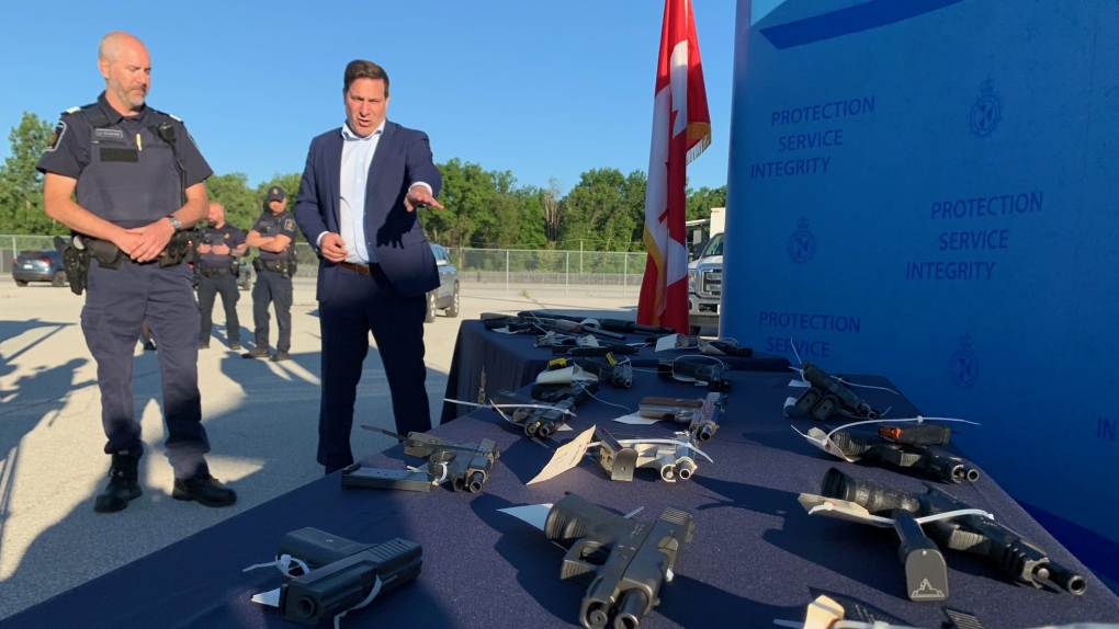 Minister of Public Safety Marco Mendicino views seized firearms at the Ambassador Bridge border crossing in Windsor, Ont., on Tuesday, June 28, 2022. (Chris Campbell/CTV News Windsor) 