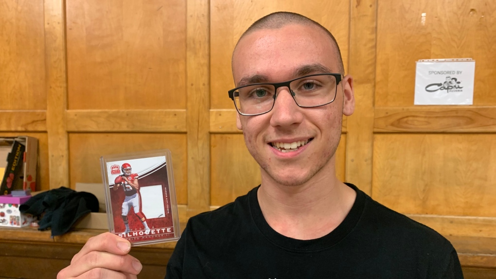 Robbie Durling holds up a Patrick Mahomes rookie card at the Rad Sports Card and Collectibles Show at the Optimist Centre in Windsor, Ont. on September 25, 2022. (Rich Garton/CTV News Windsor)
