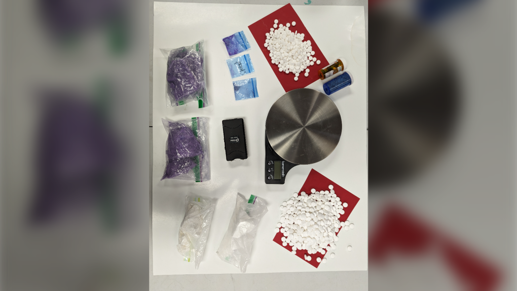 Windsor police seized a number of illegal drugs, a taser, cash and a safe during a routine vehicle stop in Windsor, Ont. (Courtesy: Windsor Police Service)