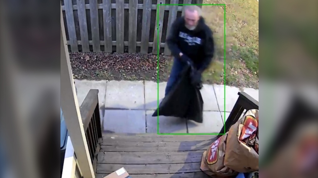 Police say a man was captured on video surveillance stealing a package from a residence in the 1000 block of Lena Avenue on Nov. 23, 2023. (Source: Windsor police)