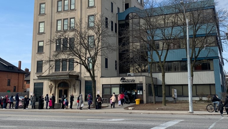 The lineup of parents and kids outside the Windsor-Essex County Health Unit in Windsor, Ont., on Tuesday, March 21, 2023. (Bob Bellacicco/CTV News Windsor)