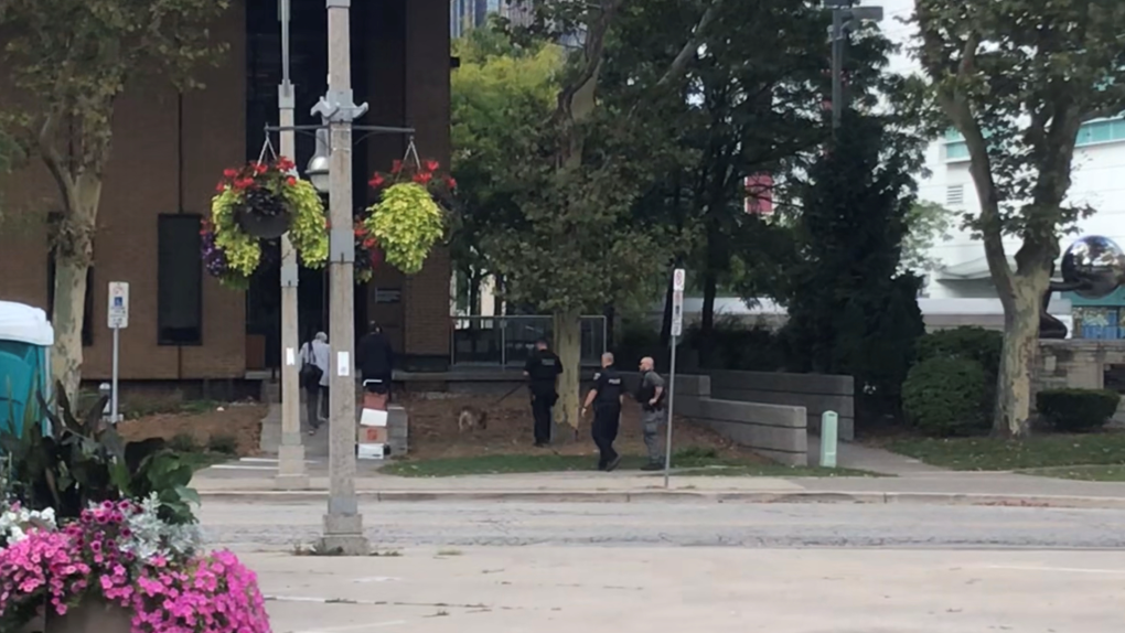 Members of the Windsor Police Service Major Crimes Unit were seen investigating a bomb threat in the area of the Ontario Court of Justice and the Superior Court of Justice on Chatham Street East on Sept. 15, 2023. (CTV News Windsor)   