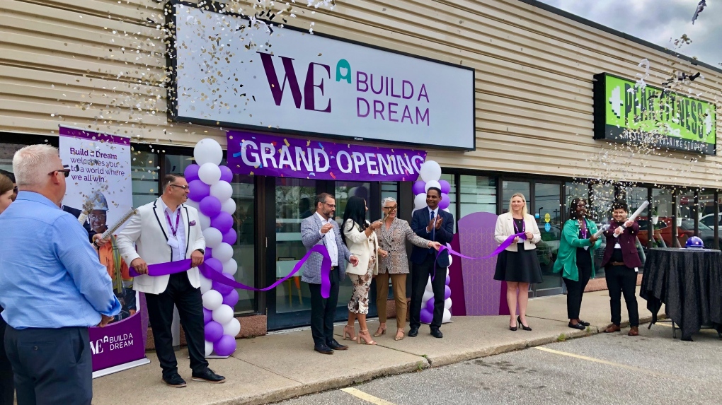 Nour Hachem cuts the ribbon at the grand opening of Build a Dream's new office. (Gary Archibald/CTV News Winsdor)